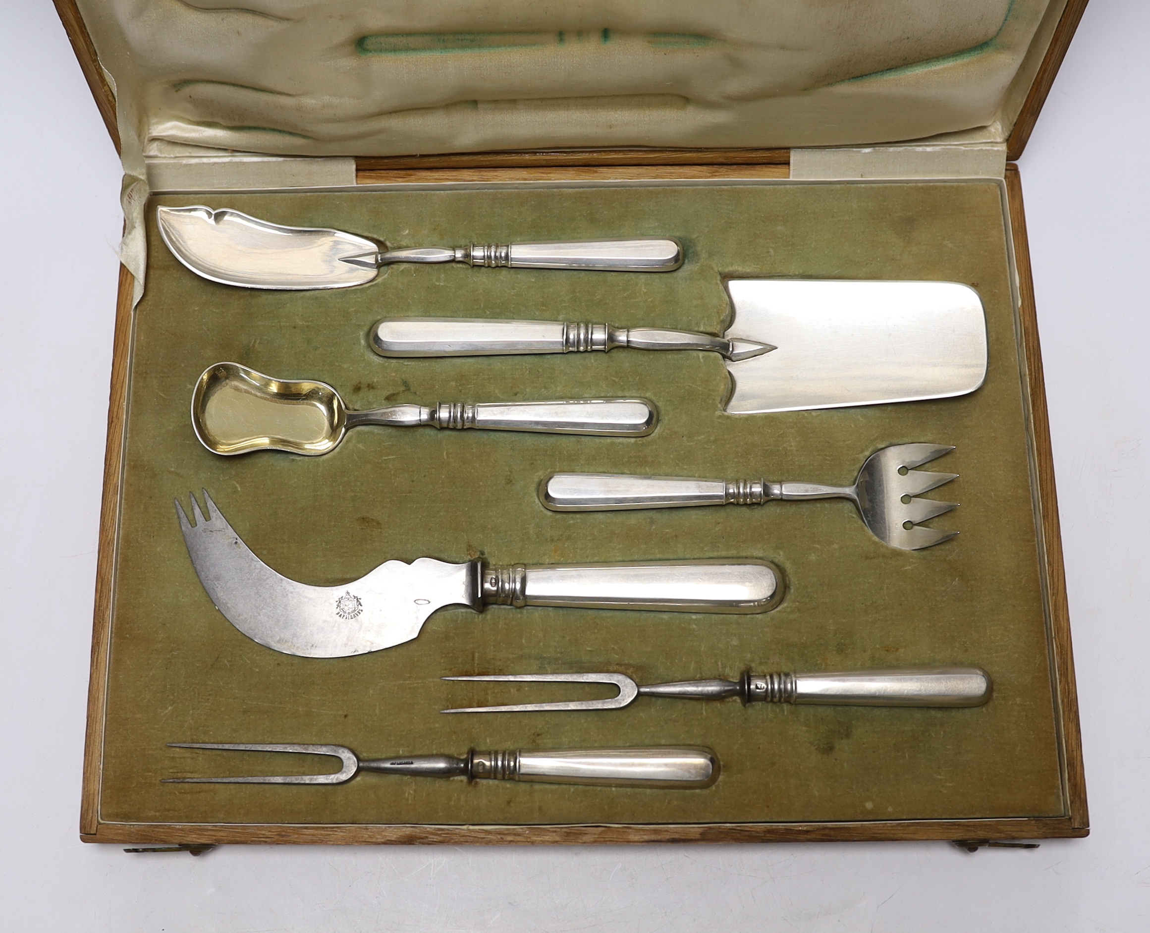 An early 20th century Russian 84 zolotnik seven piece serving set, by Ivan Morozov, largest piece 23.7cm, in original fitted oak case.